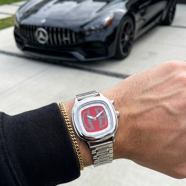 TYMELUX Y2K globe watch in Red worn on the wrist in front of a black sports car
