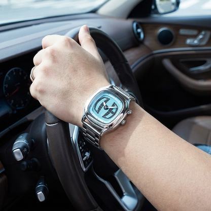 TYMELUX Y2K globe watch in Ice Blue worn in a luxury car